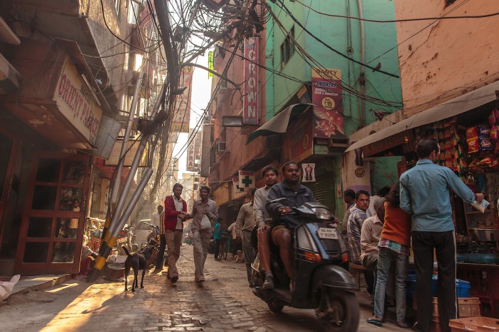 Sun filters through the busy streets of the Pahar Ganj district of New Delhi.